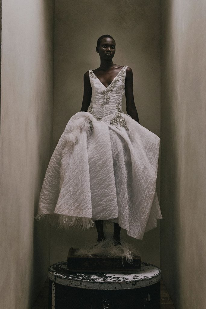 White Erdem Resort 2027 dress with an exaggerated hip silhouette from the designer’s collection.