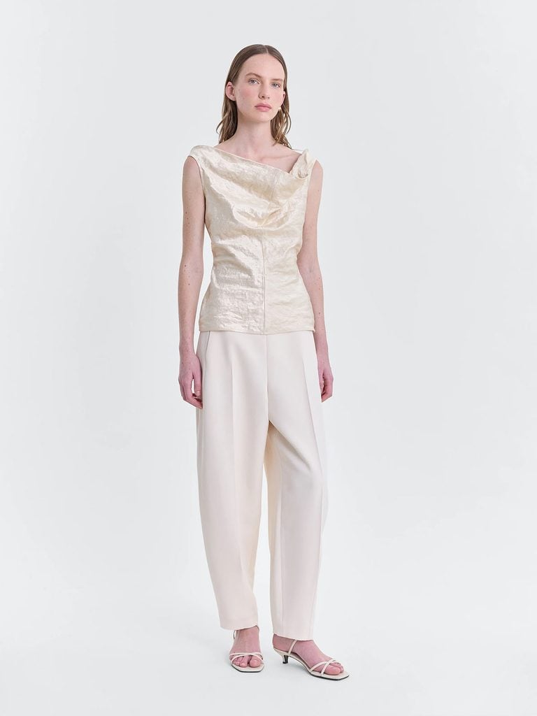 FFORME Pre-Fall 2026 ivory asymmetric top with barrel-leg trousers from the collection lookbook.