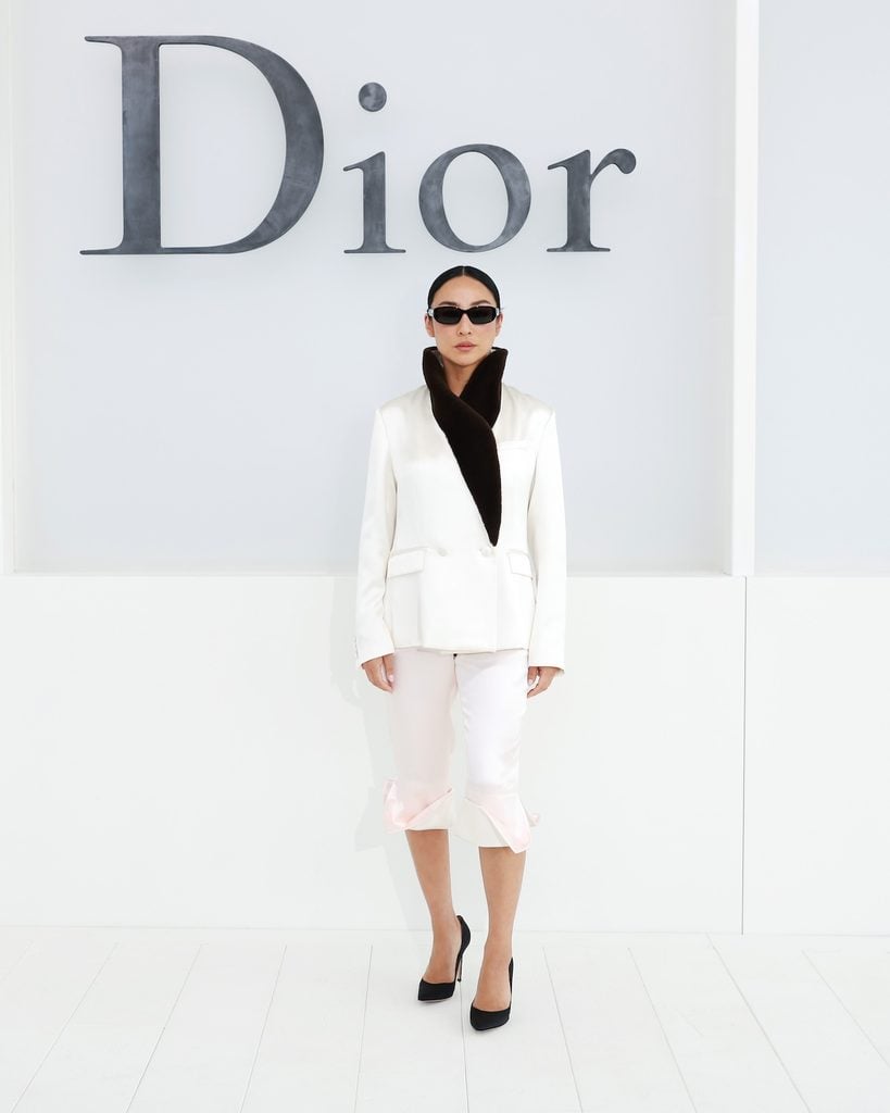 Greta Lee wearing Dior capri trousers at the Dior Spring 2027 show in Paris.