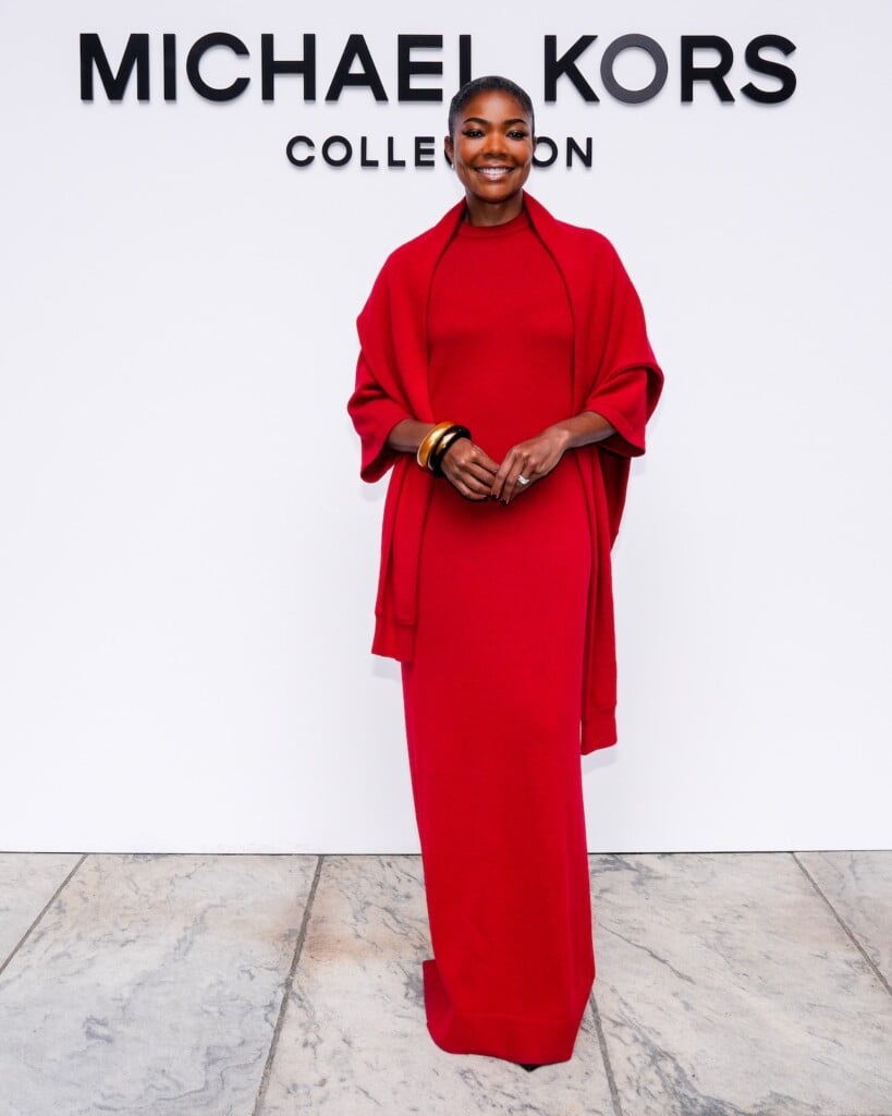 Gabrielle Union-Wade wearing a ruby Michael Kors Collection gown at the Spring/Summer 2027 show during New York Fashion Week.