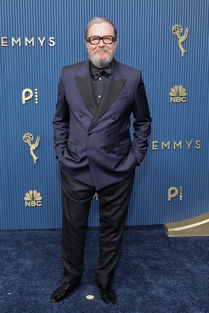 Gary Oldman wearing a navy-and-black Dior tuxedo at the 2026 Emmy Awards.