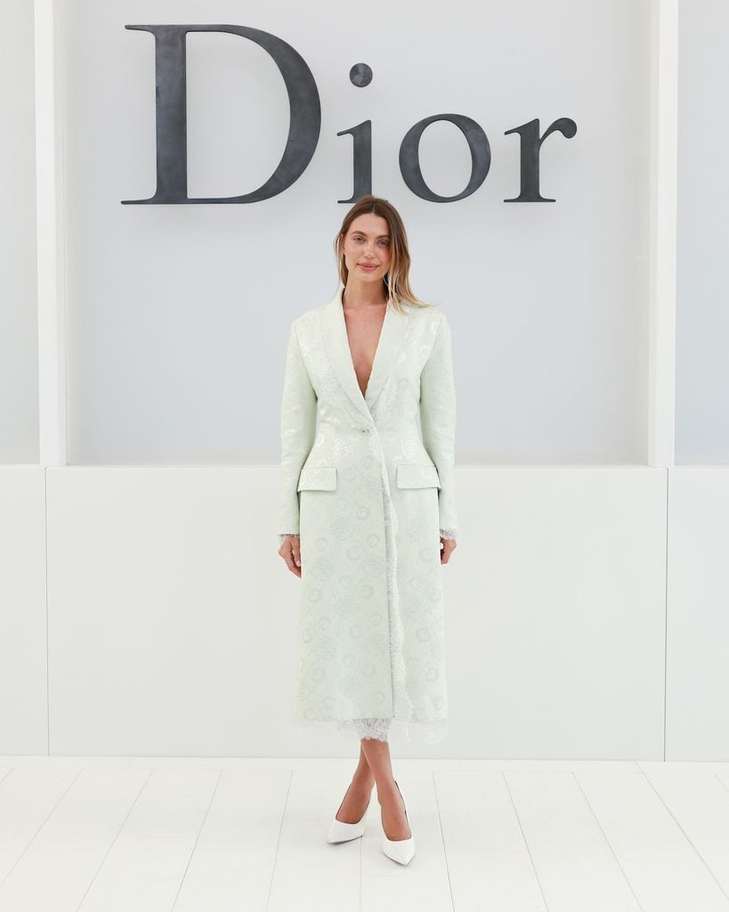 Héloïse Favier wearing a pale mint Dior coat at the Dior Spring 2027 show in Paris.