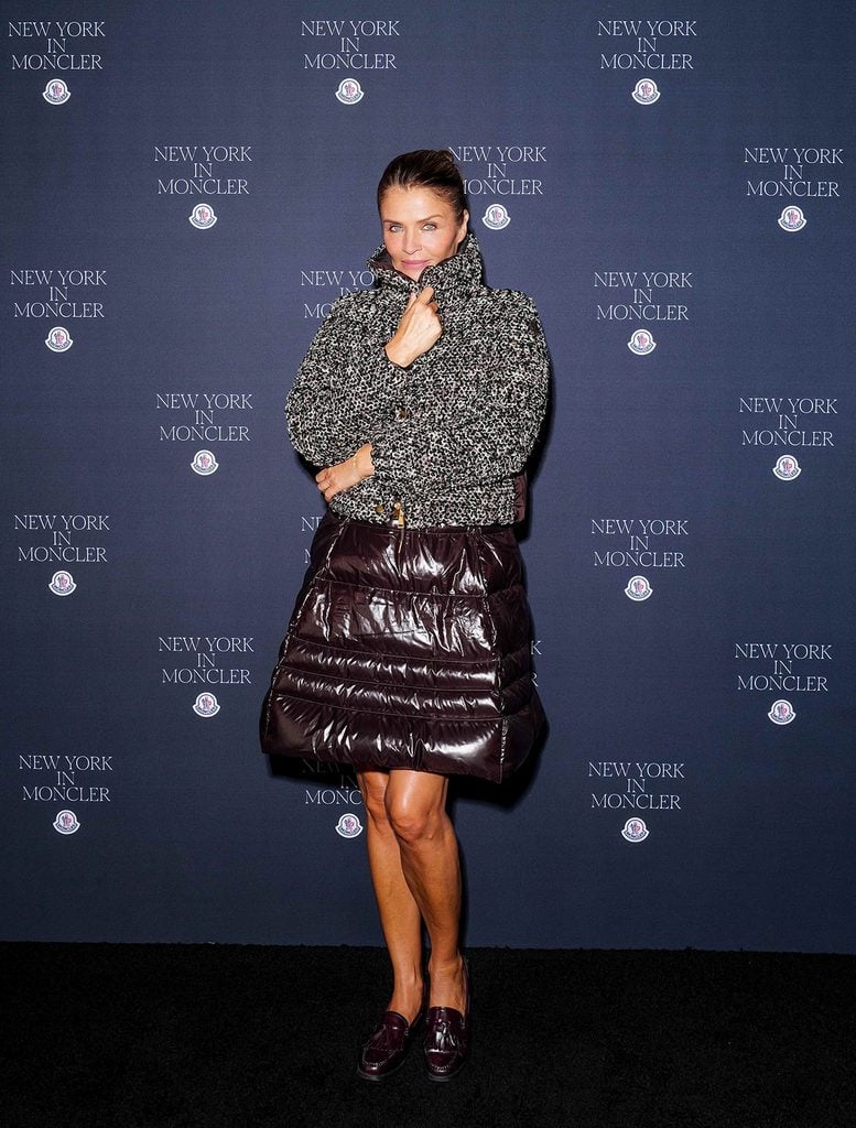 Helena Christensen wearing a textured Moncler jacket and quilted mini skirt at the Fifth Avenue flagship opening in New York.