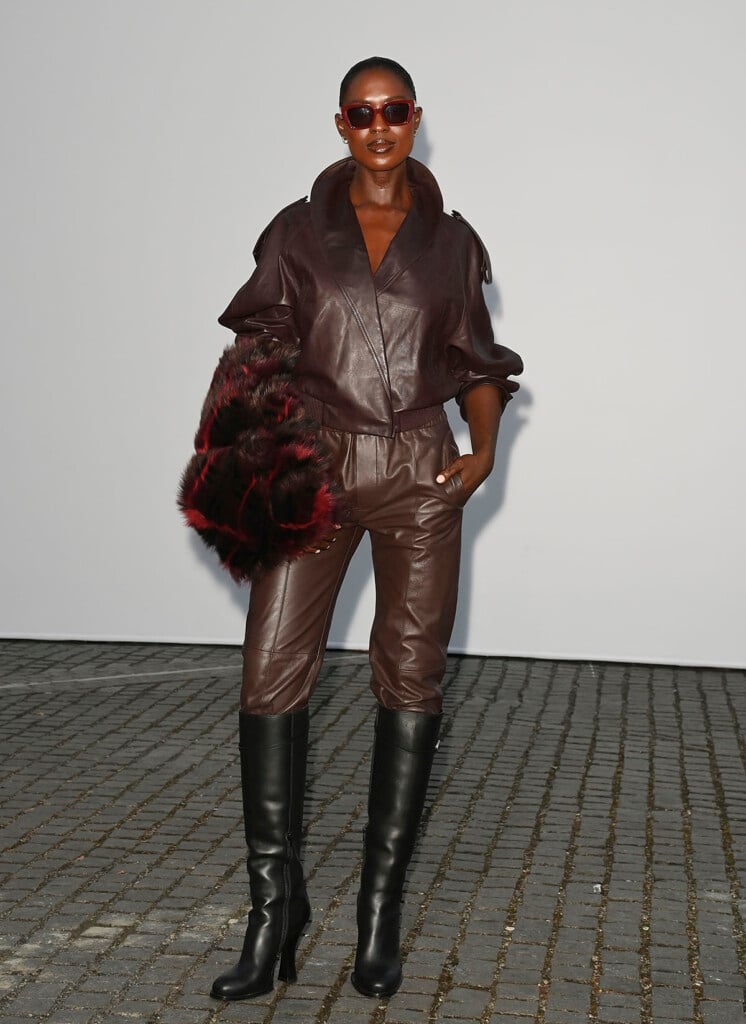 Jodie Turner-Smith wearing brown leather Burberry trousers and a matching jacket at the Burberry Summer 2027 show in London
