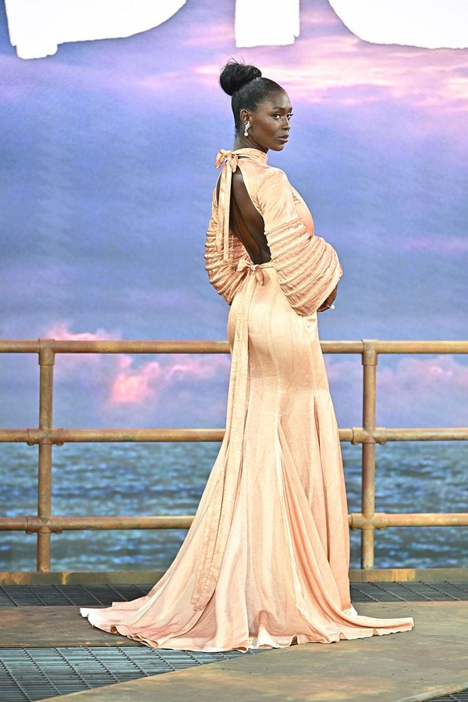 Jodie Turner-Smith in a custom rust-pink Louis Vuitton gown at the DiggeJodie Turner-Smith in a custom rust-pink Louis Vuitton gown at the Digger global premiere in Londonr global premiere in London