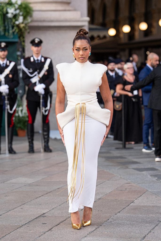 Jordyn Woods wearing a white Stéphane Rolland Haute Couture corseted gown with flowing chiffon and a thigh-high split at Vogue World Milano.