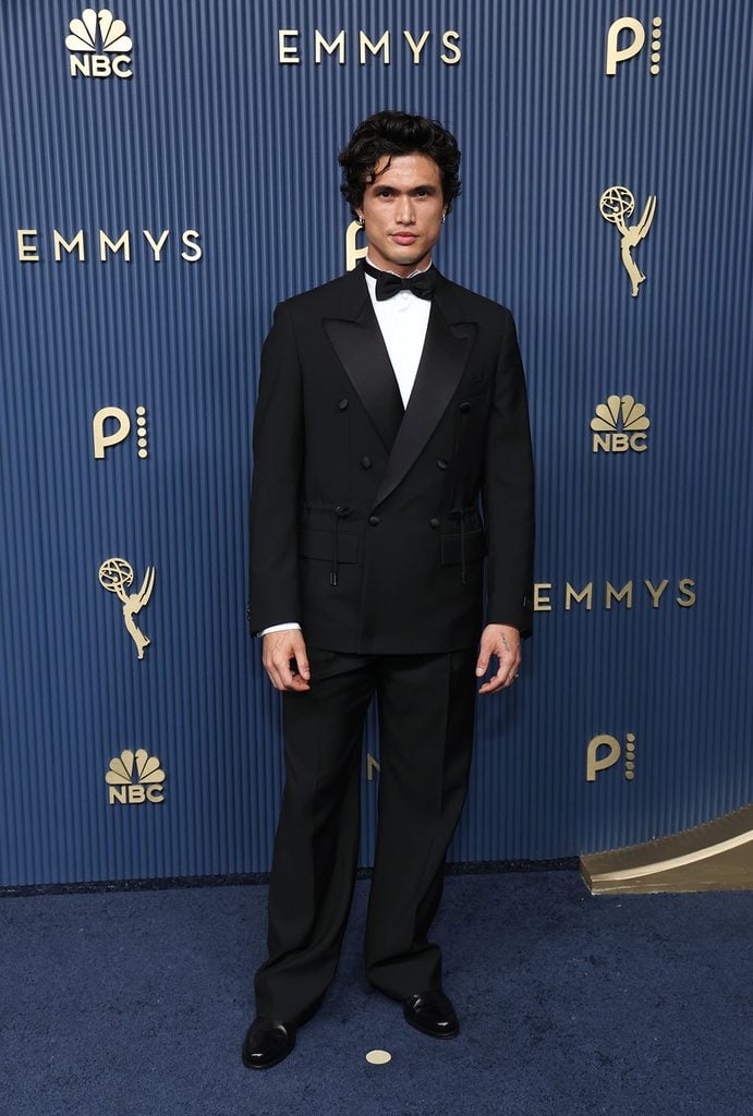 Charles Melton wearing a black double-breasted Louis Vuitton tuxedo at the 2026 Emmy Awards.