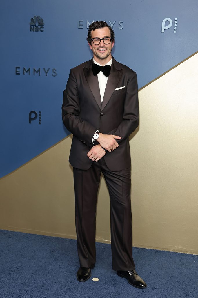 Paul Anthony Kelly wearing a brown Louis Vuitton tuxedo with a butter-yellow shirt at the 2026 Emmy Awards.