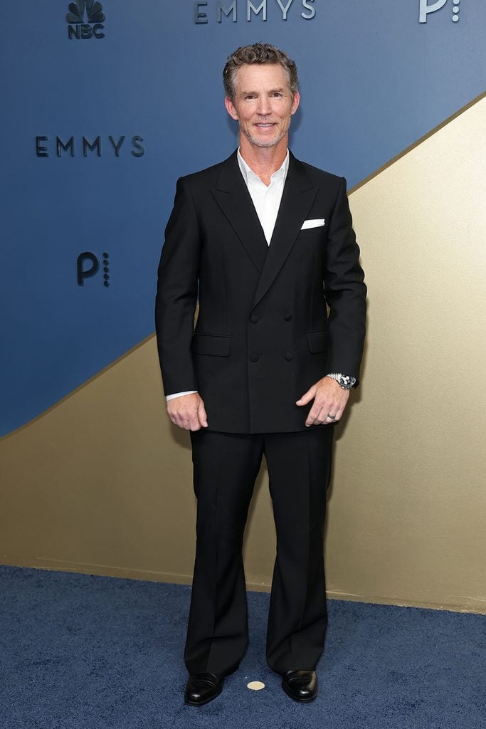 Shawn Hatosy wearing a black Louis Vuitton suit with flared trousers at the 2026 Emmy Awards.