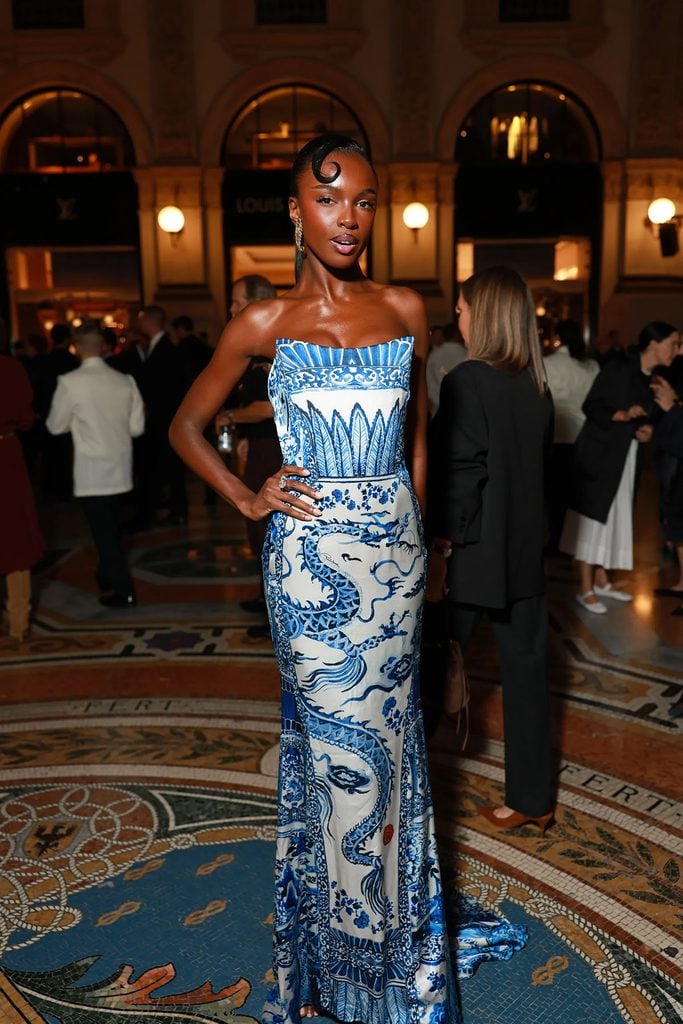 Leomie Anderson wearing a vintage Roberto Cavalli blue-and-white dragon-print column gown at Vogue World Milano.