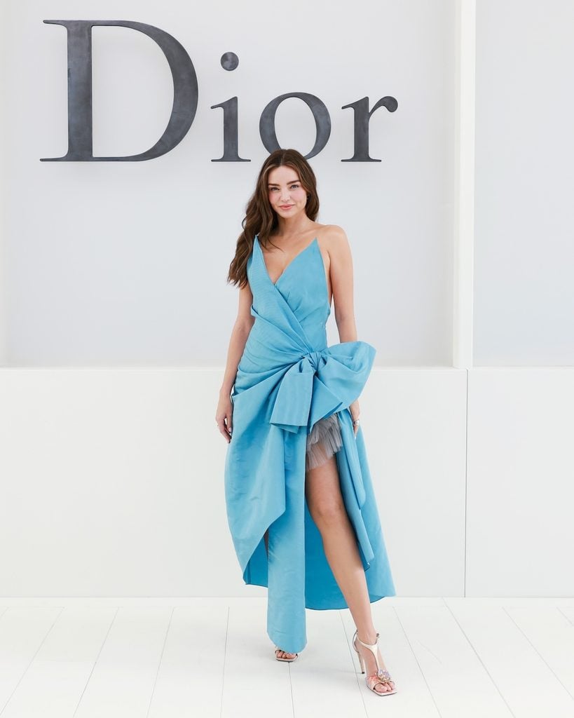 Miranda Kerr wearing a blue Dior dress at the Dior Spring 2027 show in Paris.