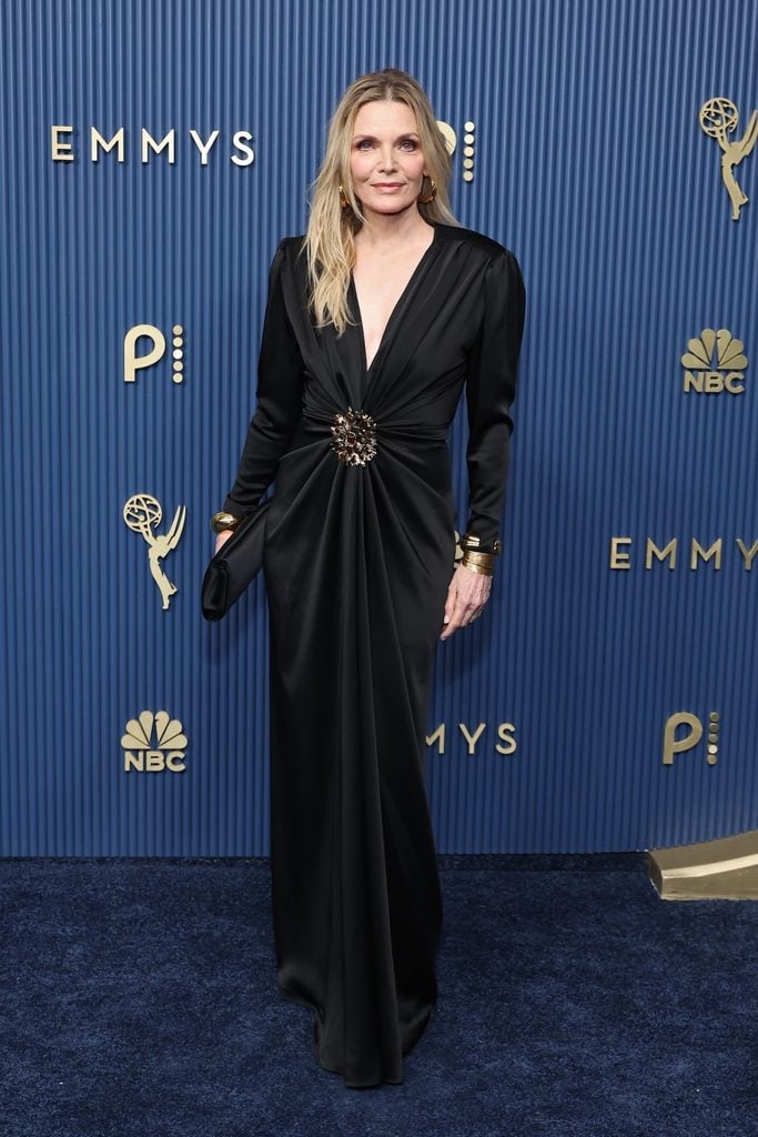 Michelle Pfeiffer wearing a black Saint Laurent gown with gold cuffs at the 2026 Emmy Awards.