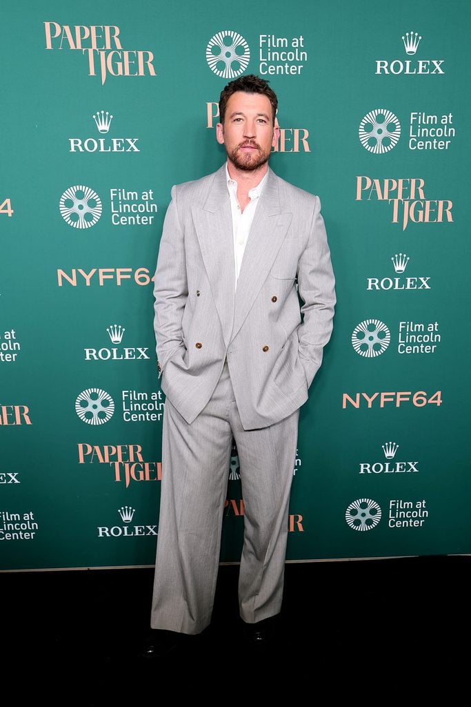 Miles Teller wears a grey AMIRI Spring 2026 suit at the ‘Paper Tiger’ premiere during New York Film Festival.