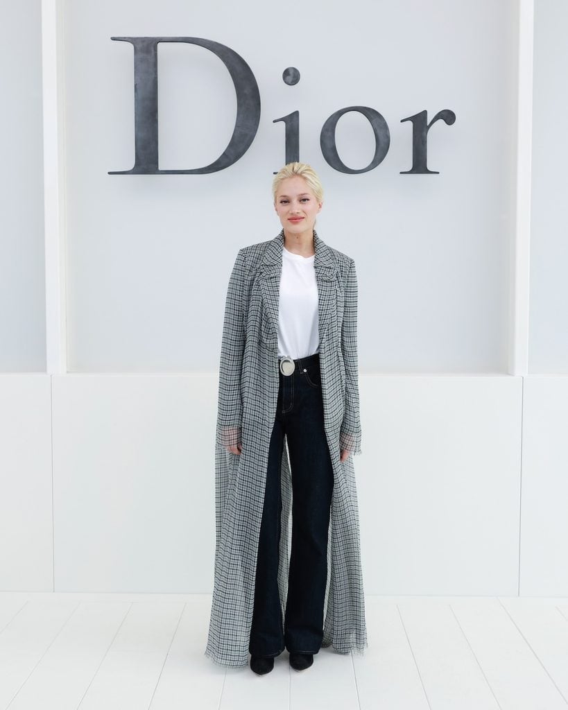 Nadia Tereszkiewicz wearing a Dior Spring 2027 checked coat at the Dior show in Paris.