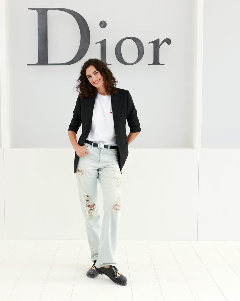 Nine d’Urso wearing distressed Dior denim at the Dior Spring 2027 show in Paris.