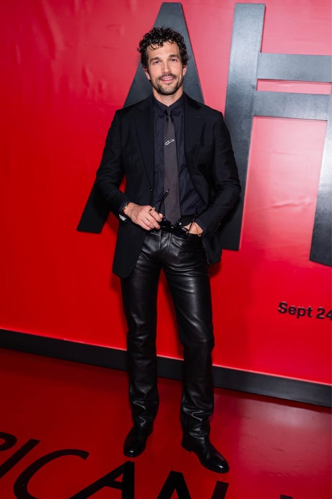 Paul Anthony Kelly in black Hermès tailoring and leather trousers, Josh Hartnett in a black Jacquemus suit and Nicholas Duvernay in brown and grey Dsquared2 tailoring.