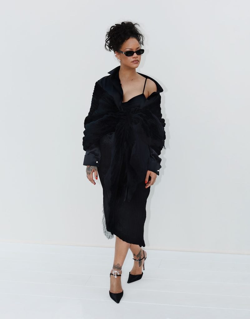 Rihanna wearing black Dior at the Dior Spring 2027 show in Paris.