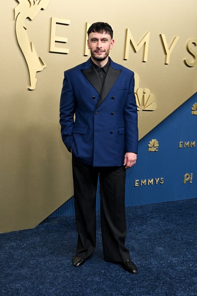 Richard Gadd wearing a blue double-breasted Celine tuxedo jacket with black trousers at the 2026 Emmy Awards.