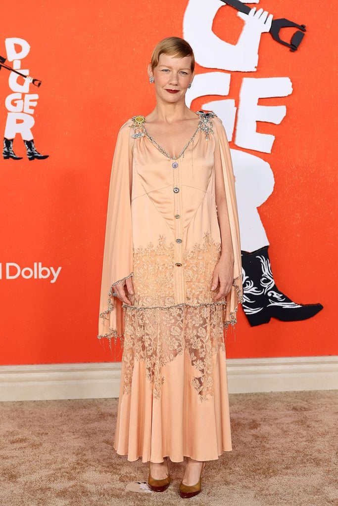 Sandra Hüller in peach Chanel Fall 2026 Haute Couture alongside the original runway look.