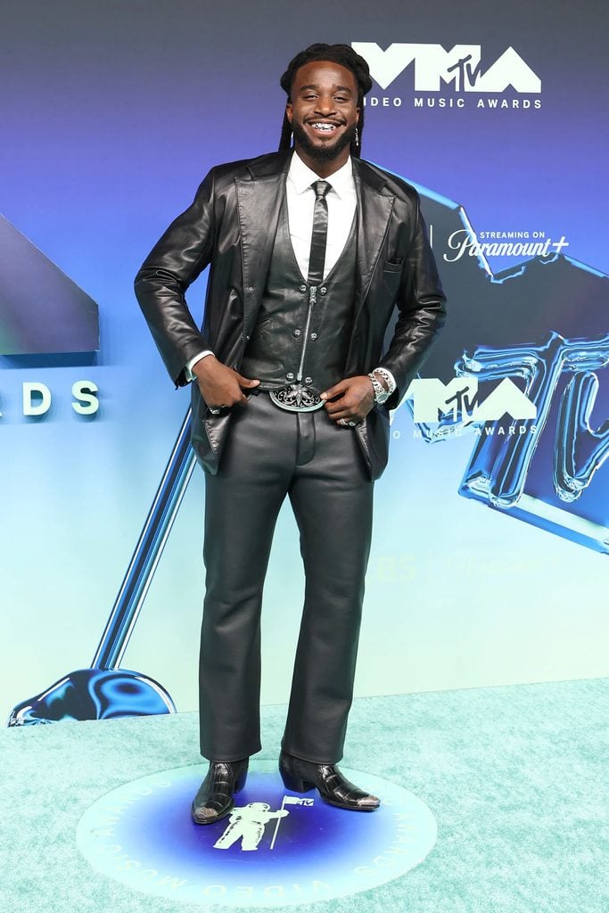 Shaboozey wearing a custom Chrome Hearts black leather three-piece suit with Western boots and a statement belt at the 2026 MTV VMAs.