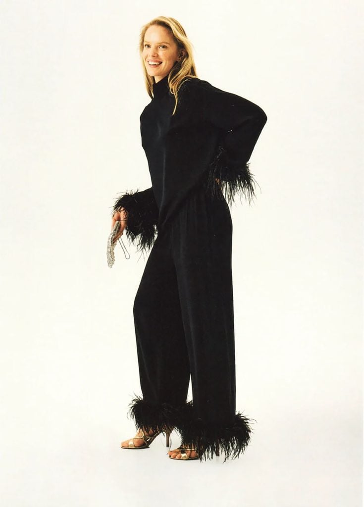 Sleeper Black Tie Pajamas in black with detachable feather-trimmed cuffs and trouser hems.