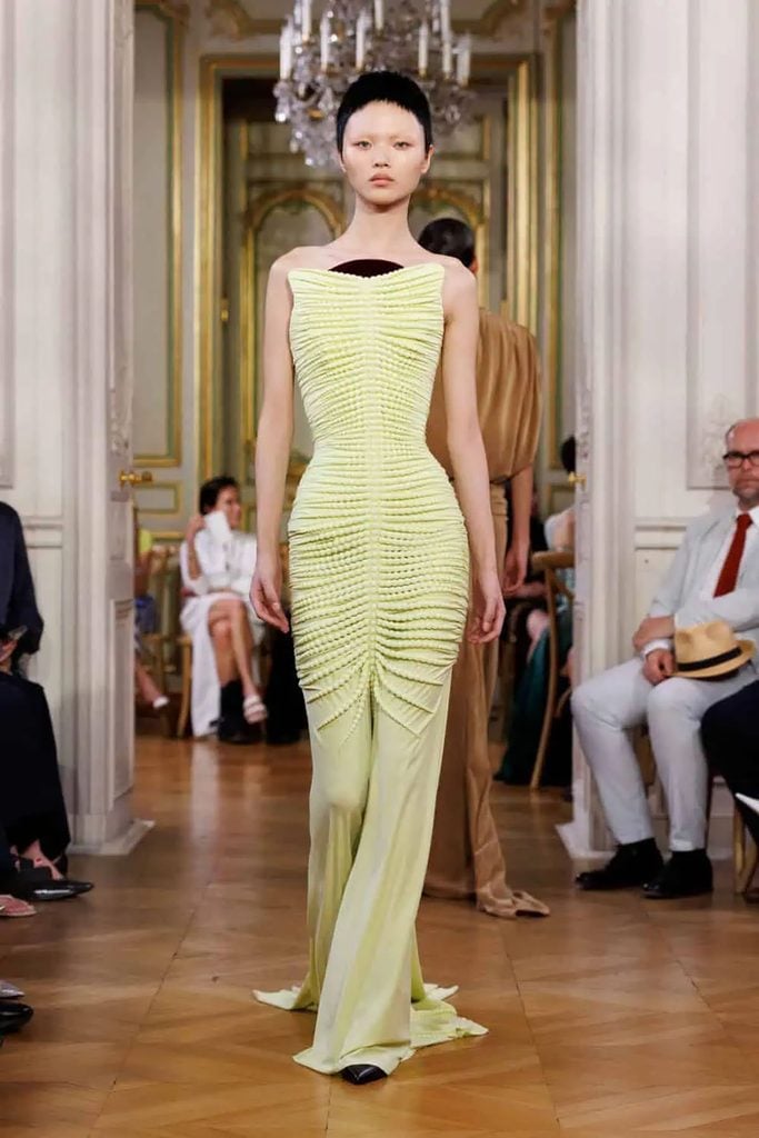 Standing Ground Fall 2026 runway gown featuring a sculpted bead-textured bodice and chartreuse floor-length skirt.