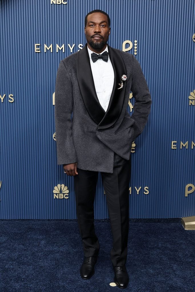 Yahya Abdul-Mateen II wearing a grey Dior shawl-lapel tuxedo jacket at the 2026 Emmy Awards.