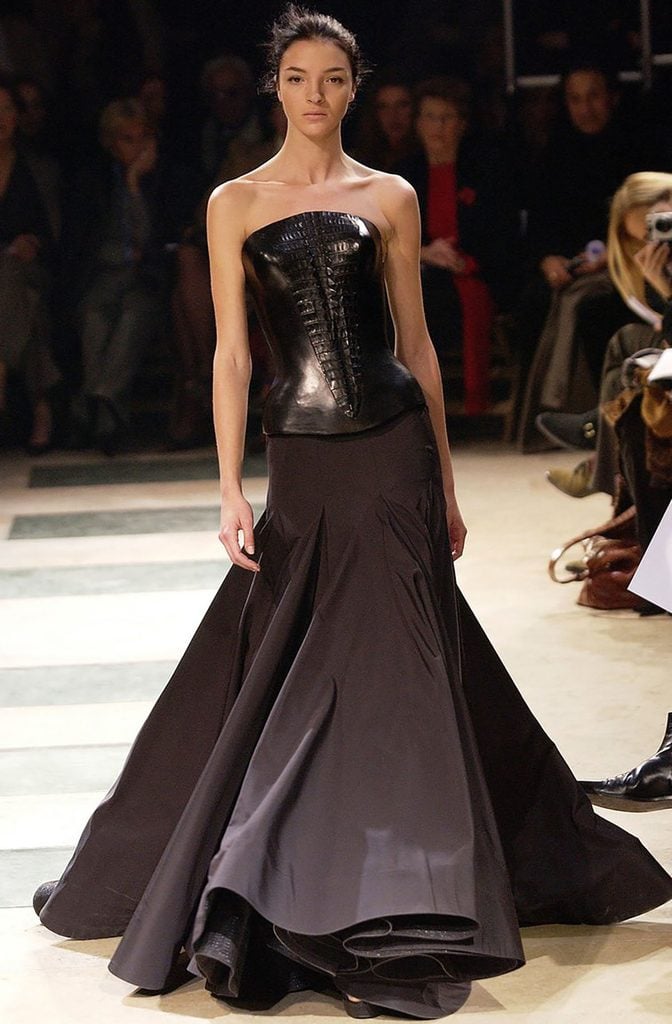 Azzedine Alaïa Spring 2003 black leather bustier and floor-length skirt on the runway.