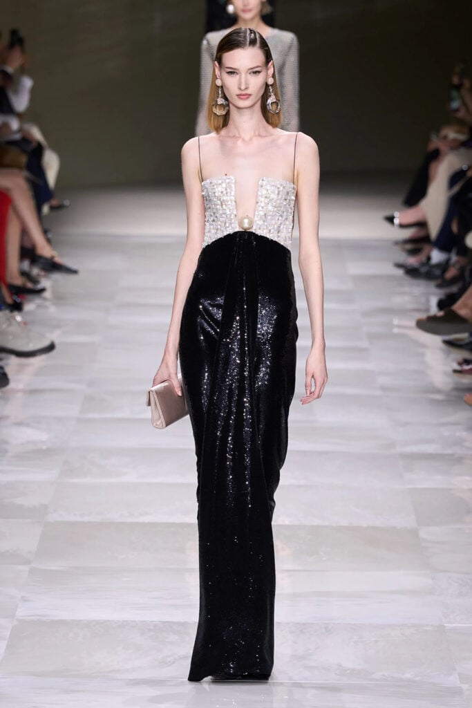 Armani Privé Fall 2024 pearl-embellished bodice and black sequinned column gown on the couture runway.