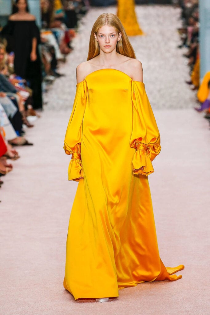 Carolina Herrera Spring 2019 taxi-cab-yellow off-the-shoulder gown on the runway.