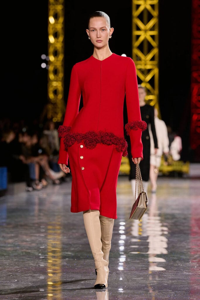 Chanel Fall 2026 red suit featuring the fringed peplum and three-button detail that inspired Penélope Cruz’s custom Venice gown.