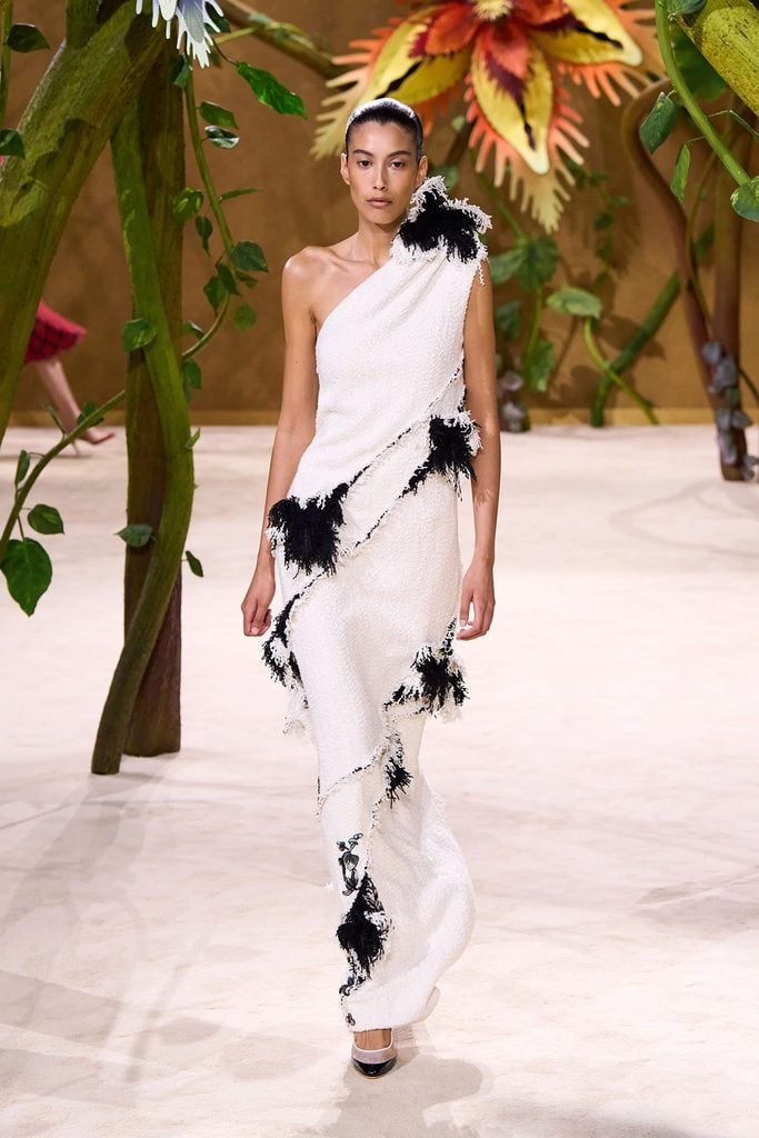 Chanel Fall 2026 white tweed embroidered dress on the runway.