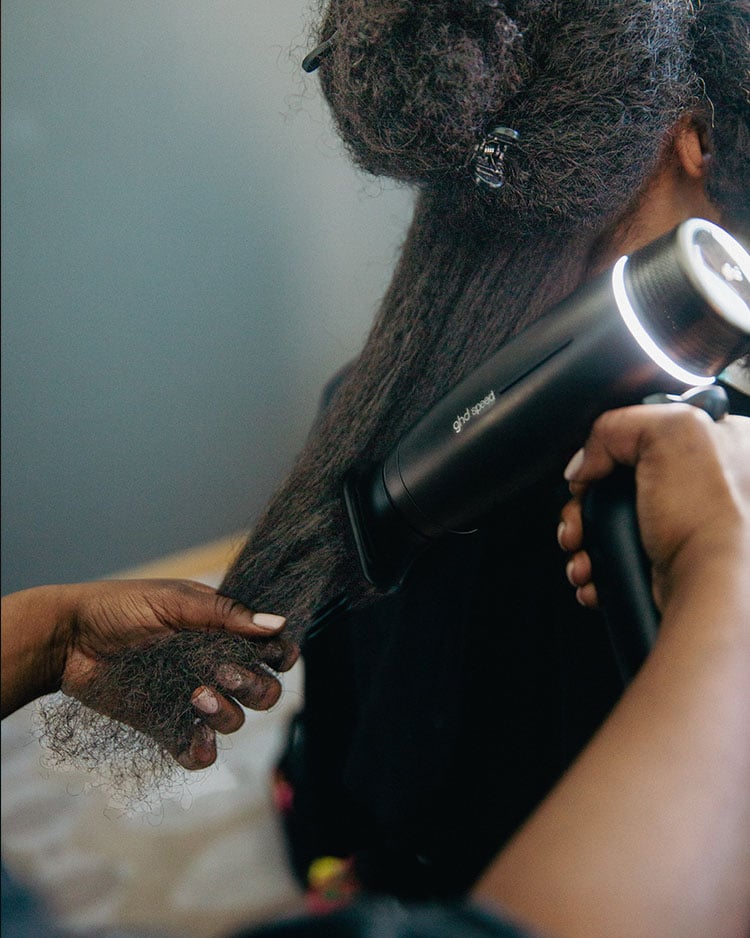 Chase Infiniti showcases the sleek, glossy finish of her SheaMoisture-styled hair on the Emmys red carpet.