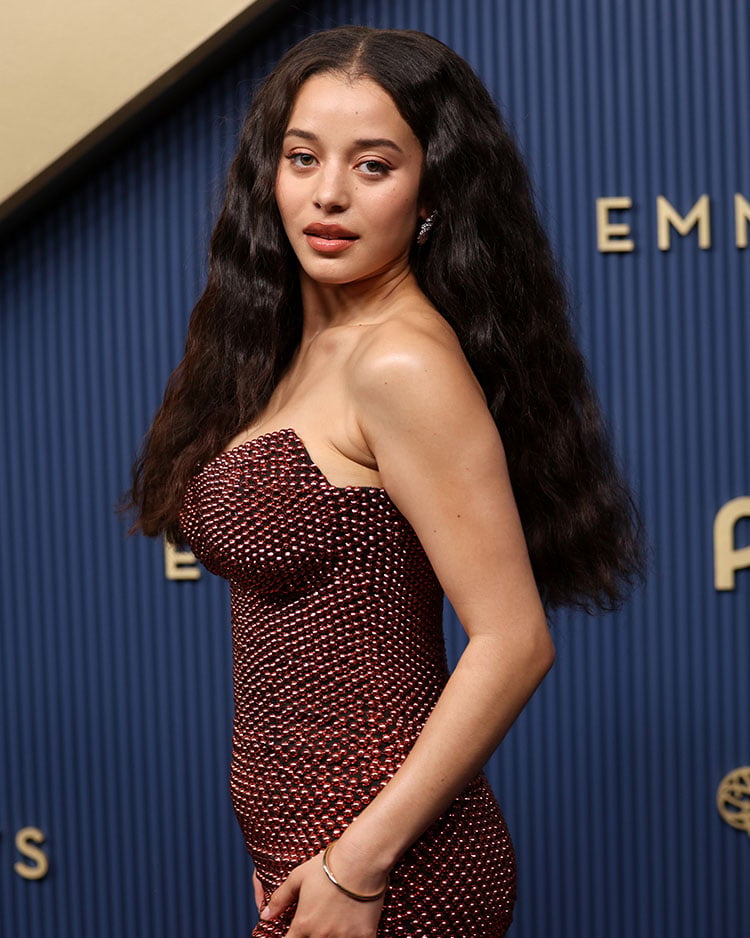 Chase Infiniti wears long, centre-parted soft waves created by hairstylist Lacy Redway for the Emmys.