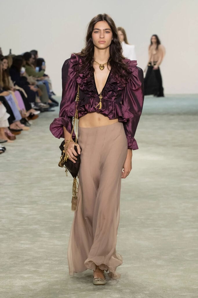 Chloé Fall 2025 runway look featuring the eggplant ruffled blouse later worn by Maggie Gyllenhaal at the Venice Film Festival.