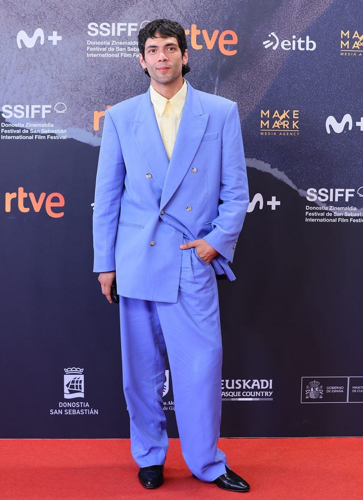 Diego Calva wearing a periwinkle-blue Willy Chavarria suit with a pale yellow shirt at the San Sebastián International Film Festival