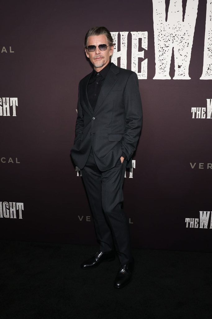Ethan Hawke wears a charcoal Prada suit at The Weight New York screening