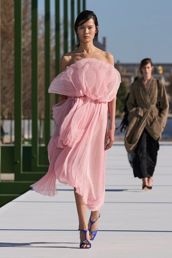 Ever Anderson in Dior Fall 2026 alongside the pink dress as presented on the runway.