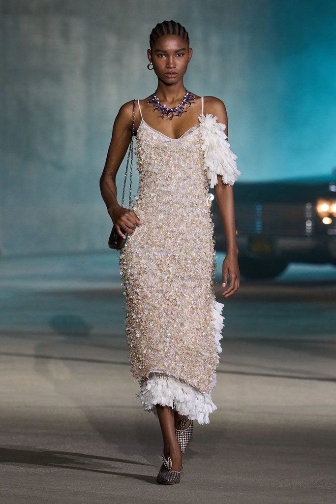 Ever Anderson in Dior Resort 2027 alongside the embroidered dress as presented on the runway.