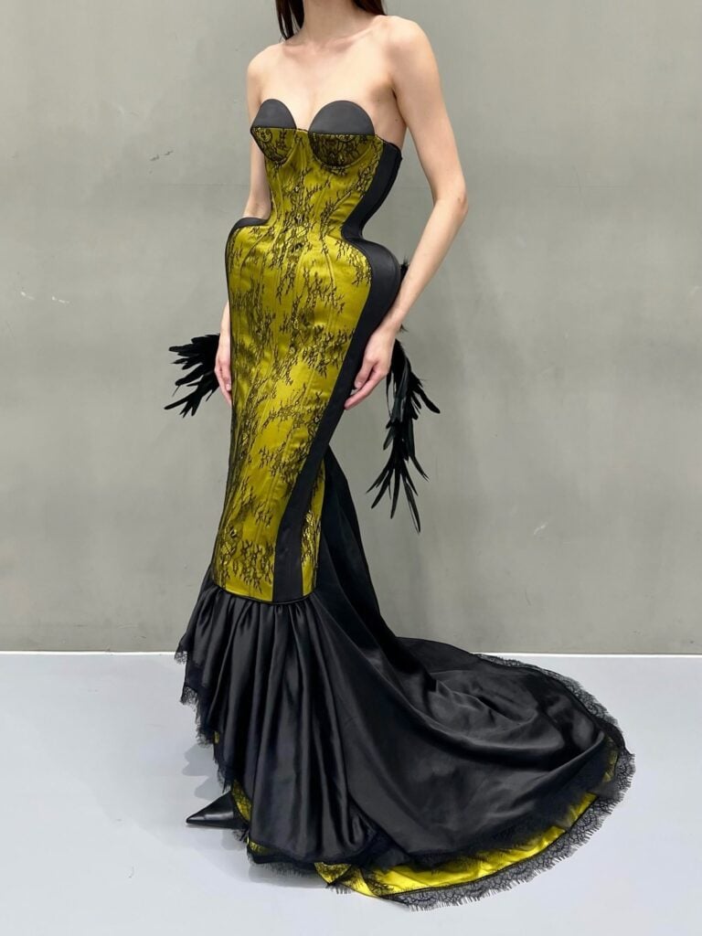Ilya Mingmoon chartreuse and black lace corset dress worn by Joey King to the Practical Magic 2 LA premiere, shown from the front.