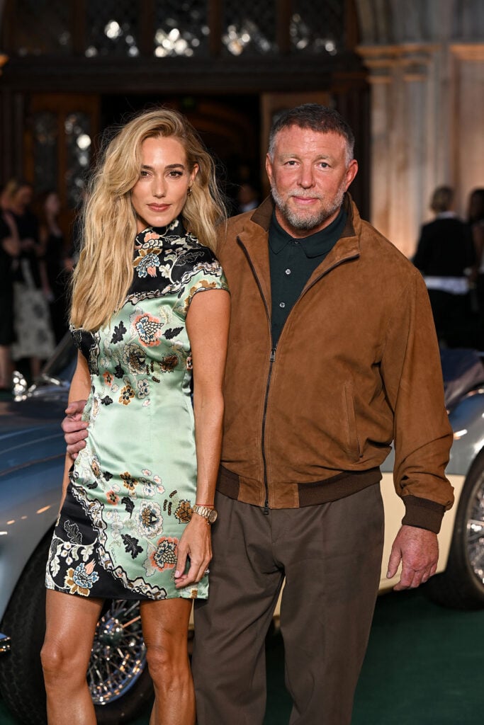 Jacqui Ainsley wearing an archival Roberto Cavalli Spring 2003 mini dress at The Gentlemen Season Two London premiere with husband Guy Ritchie.
