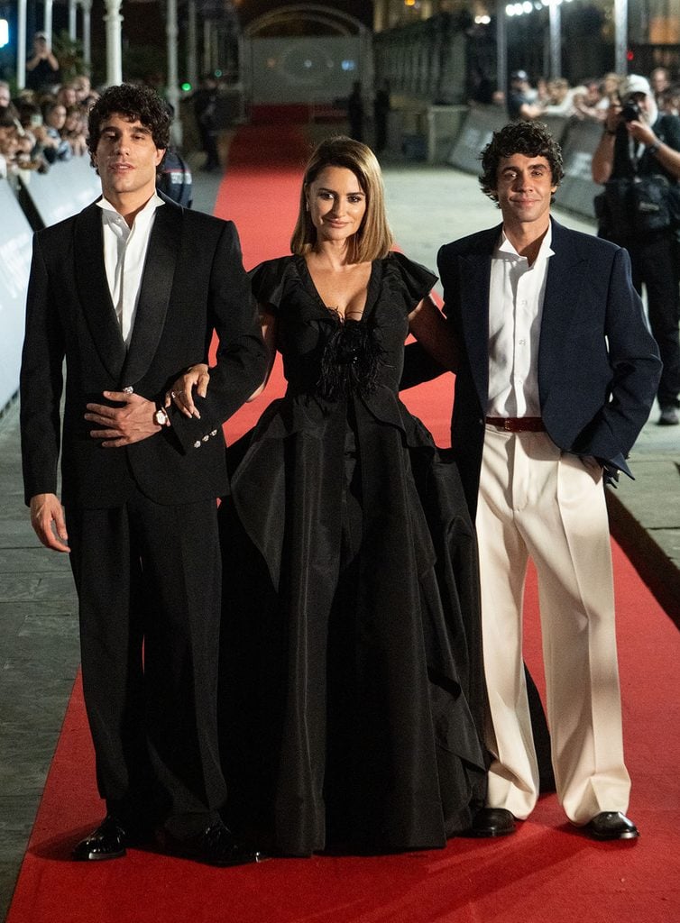 Javier Calvo and Javier Ambrossi wearing contrasting Chanel menswear looks at the La Bola Negra premiere during the San Sebastián International Film Festival