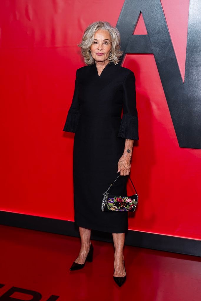 Jessica Lange wearing a black Valentino dress with pleated cuffs and a floral Valentino Garavani DeVain bag at FX’s American Horror Story: 13 Celebration Event.