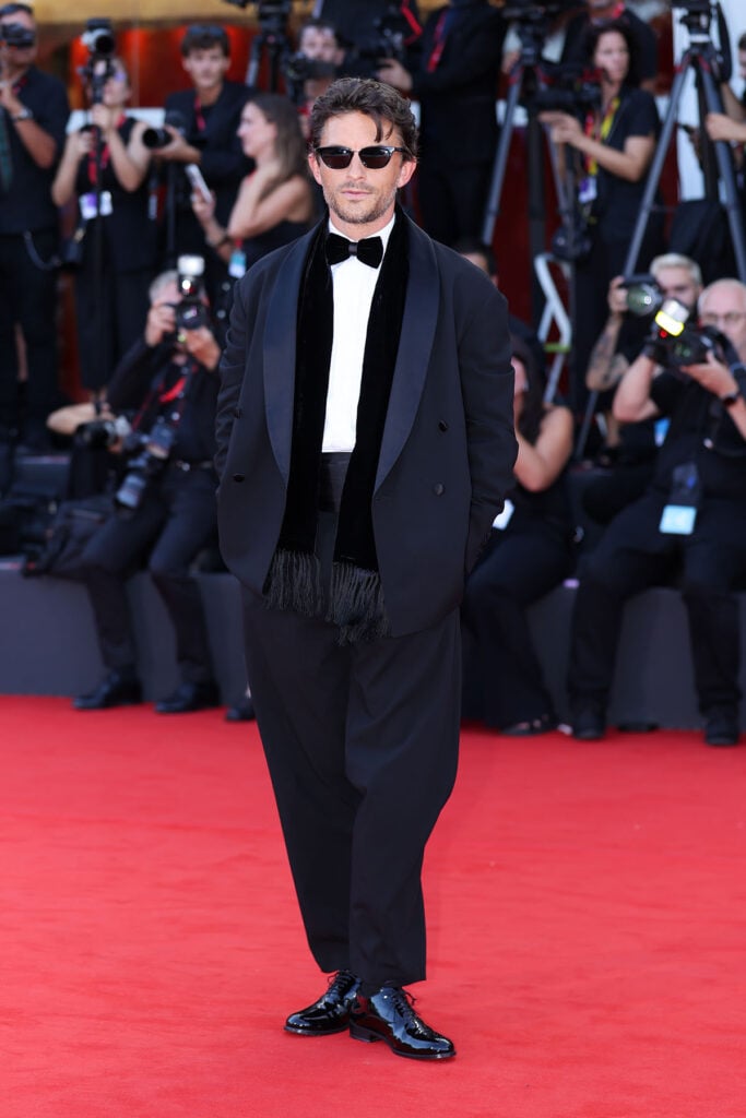Jonathan Bailey wearing a Giorgio Armani tuxedo at the 2026 Venice Film Festival opening night for the Ink premiere
