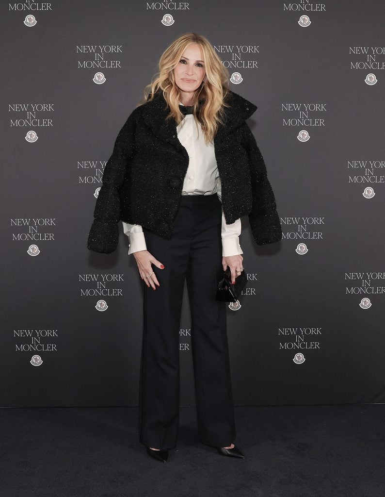 Julia Roberts wearing a cropped Moncler jacket with Marco Bicego jewels at the Fifth Avenue flagship opening in New York.