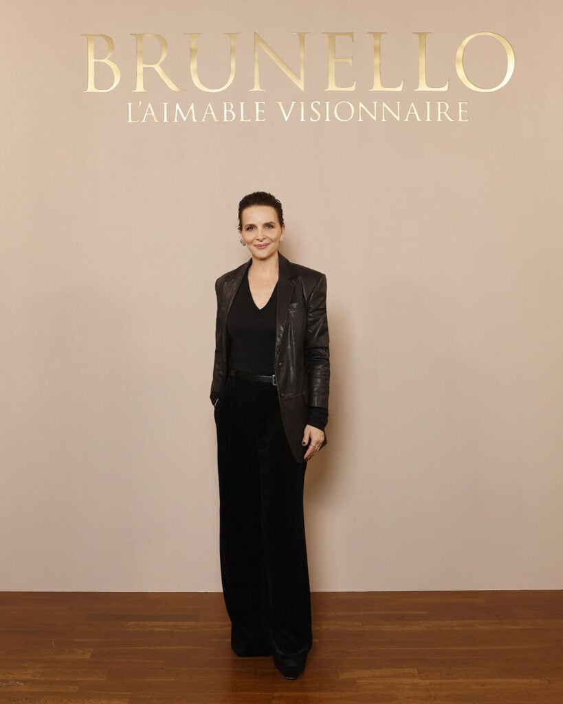 Juliette Binoche wears an all-black Brunello Cucinelli look with a leather blazer at the Brunello Cucinelli Paris boutique celebration.