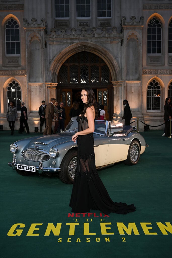 Kaya Scodelario wearing Bvlgari High Jewelry with her black Paolo Sebastian Couture gown at The Gentlemen premiere.