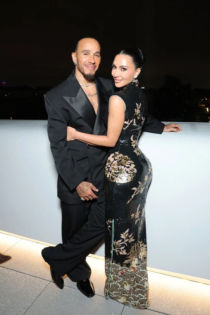 Lewis Hamilton in Saint Laurent Kim Kardashian wearing vintage Yves Saint Laurent by Tom Ford at the Lucas Museum of Narrative Art opening in Los Angeles.