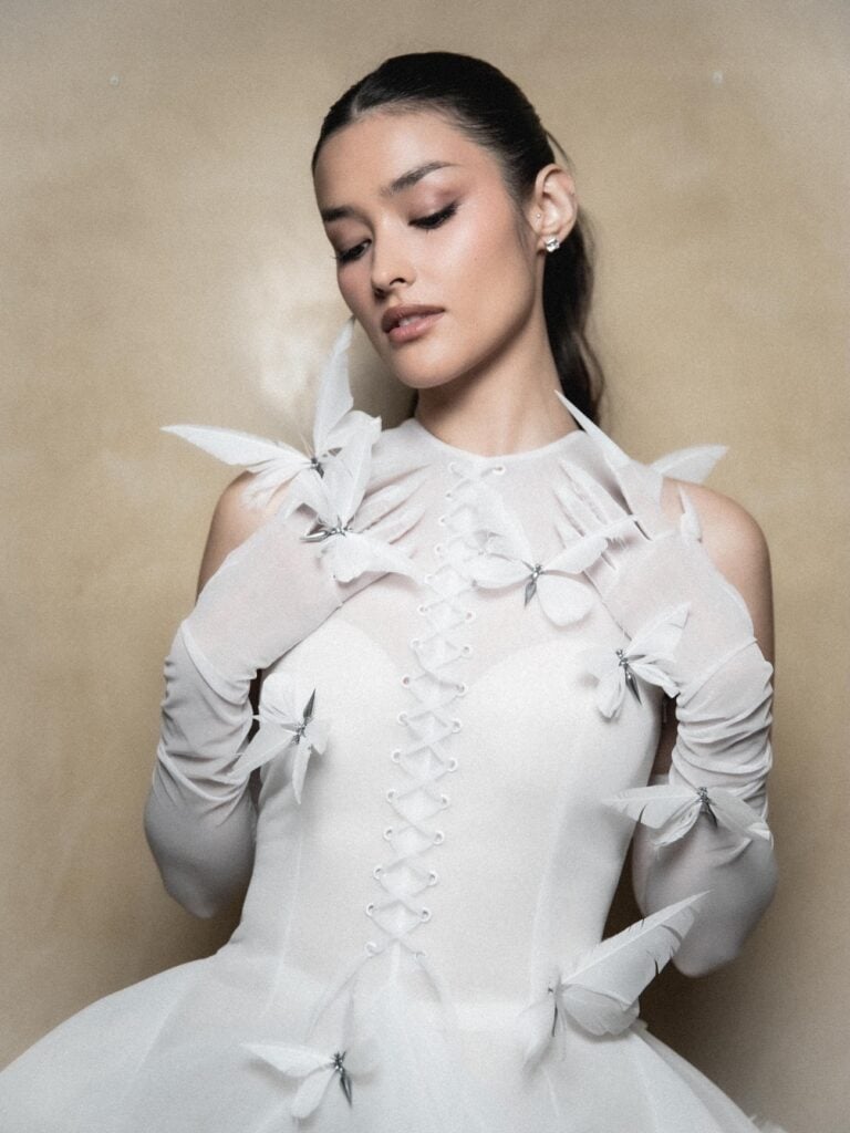 Liza Soberano showcases the corset lacing and butterfly details of her white Robert Wun couture gown in Venice.