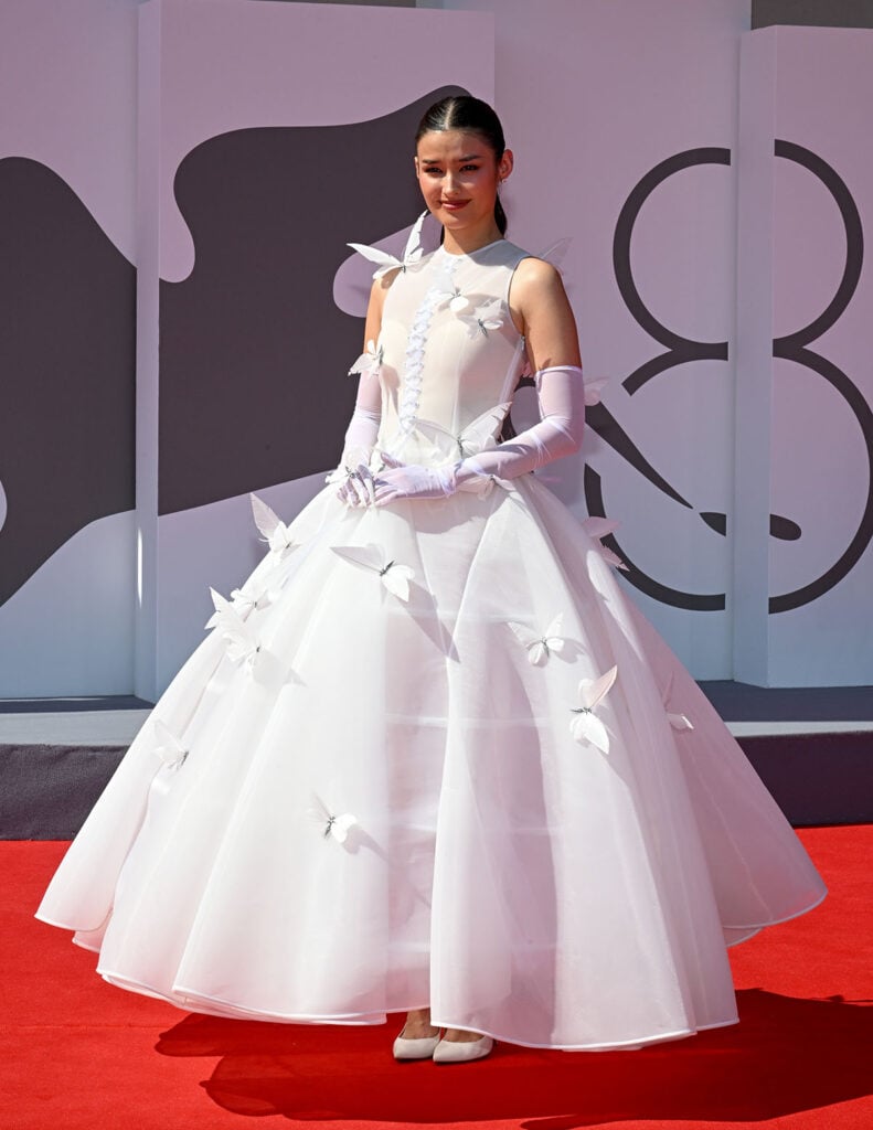 Forgotten Island star Liza Soberano wears a white Robert Wun butterfly gown at the 2026 Venice Film Festival.